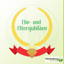 Eine Grafik mit goldenem Lorbeerkranz, über einem roten Banner mit Art Deco Element, im Kranz die Schrift Ehe- und Altersjubiläen.