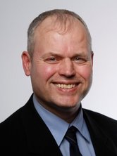 Passbild von Ekkehard Arnoldi, Portrait, lächelnd.